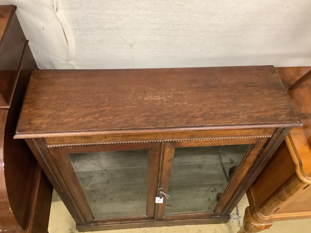 An early 20th century oak pier cabinet, width 90cm depth 28cm height 104cm